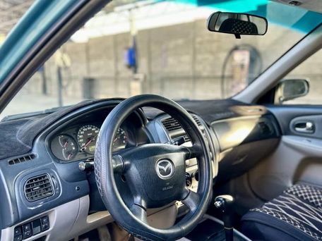 Mazda 323, 2001 — photo 11