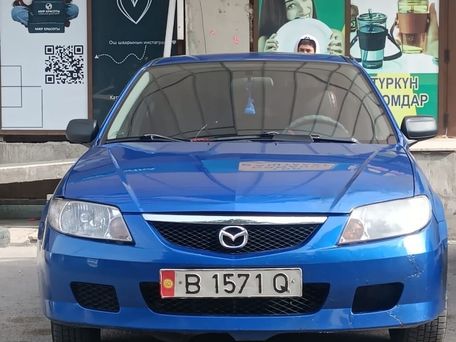 Mazda 323, 2003 — photo 1
