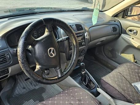 Mazda 323, 2001 — photo 7